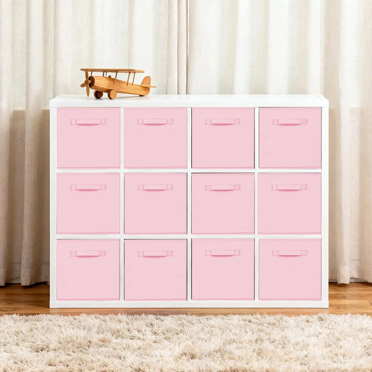 Pink Fabric Storage Cubes in White Shelf Unit